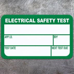 Ενδεικτική πράσινη και λευκή ετικέτα ELECTRICAL SAFETY TEST με κενά πεδία
