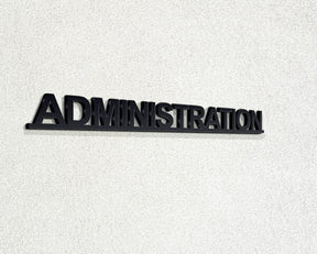 Αυθεντική μαύρη επιγραφή ADMINISTRATION ως δείγμα σχήματος για τη λευκή έκδοση